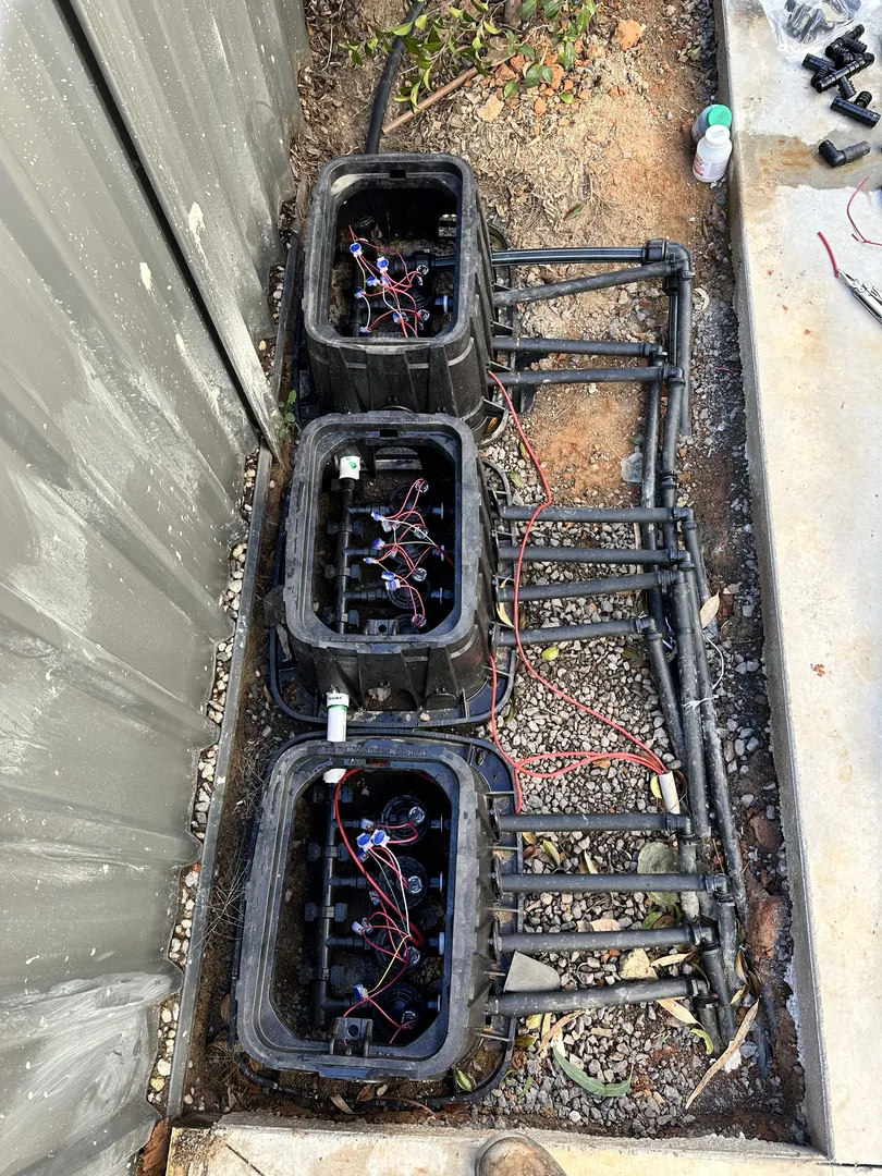 Underground utility boxes with electrical wiring and pipes.